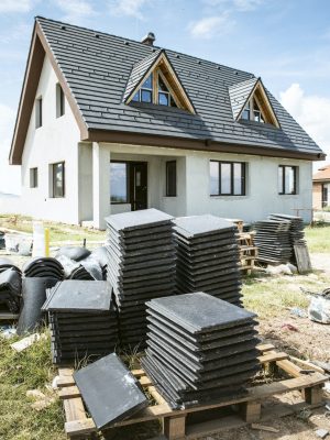 Stacked slate roof tiles prepared for installation on a South Florida residential property