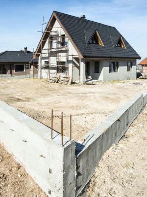 Certified roof inspector examining new residential construction in South Florida
